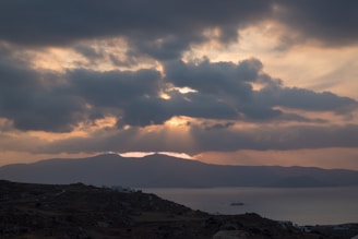 Sunset casting golden light over a mountain trail overlooking the Adriatic Sea.