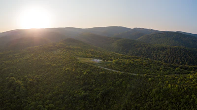 A serene view of open land where Veilwood Village will soon rise, bathed in golden sunlight.