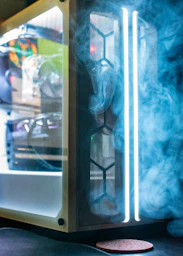 a computer case with smoke coming out of it