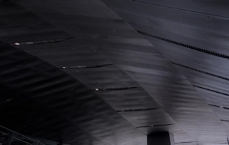 Modern ceiling with microperforated metal panels creating a sleek look.
