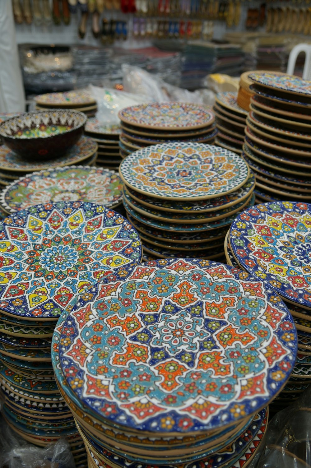 a table topped with lots of colorful plates