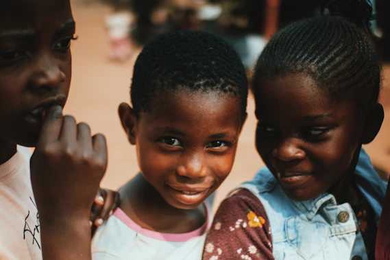 a group of young children standing next to each other