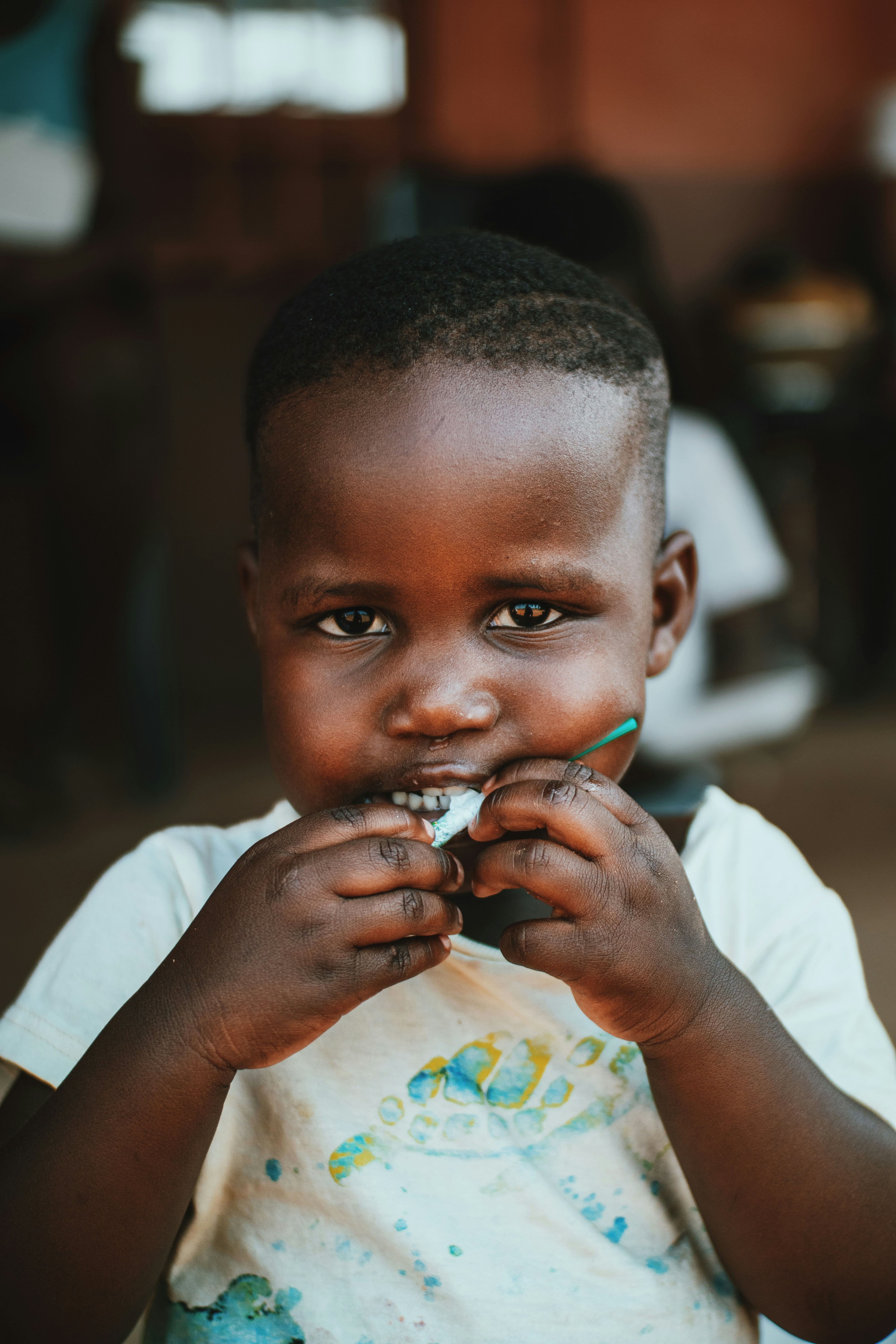 a little boy that is eating some food