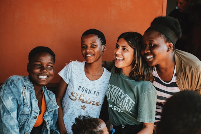 a group of people standing next to each other