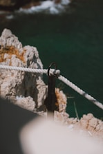 Close-up of a durable rock anchor installation securing a steep hillside.