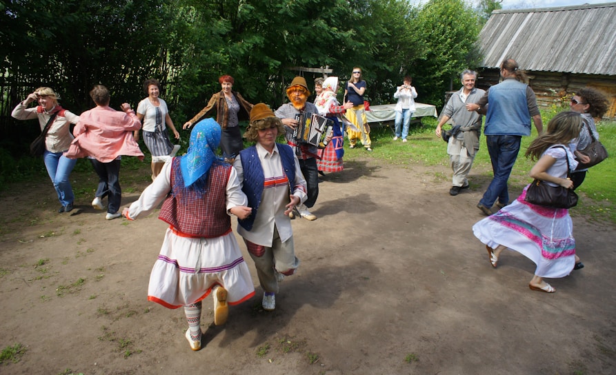 A lively community gathering in Konice, with people of all ages enjoying traditional music and dance outdoors.