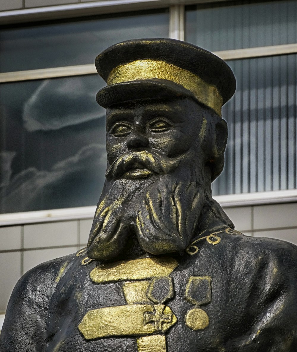 a statue of a man with a hat and beard