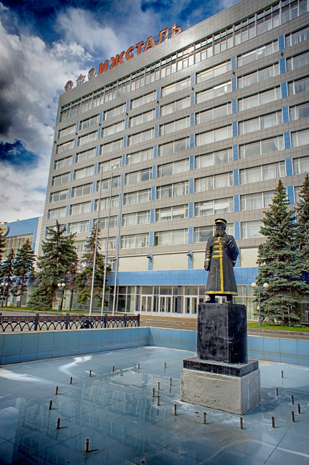 a large building with a statue in front of it