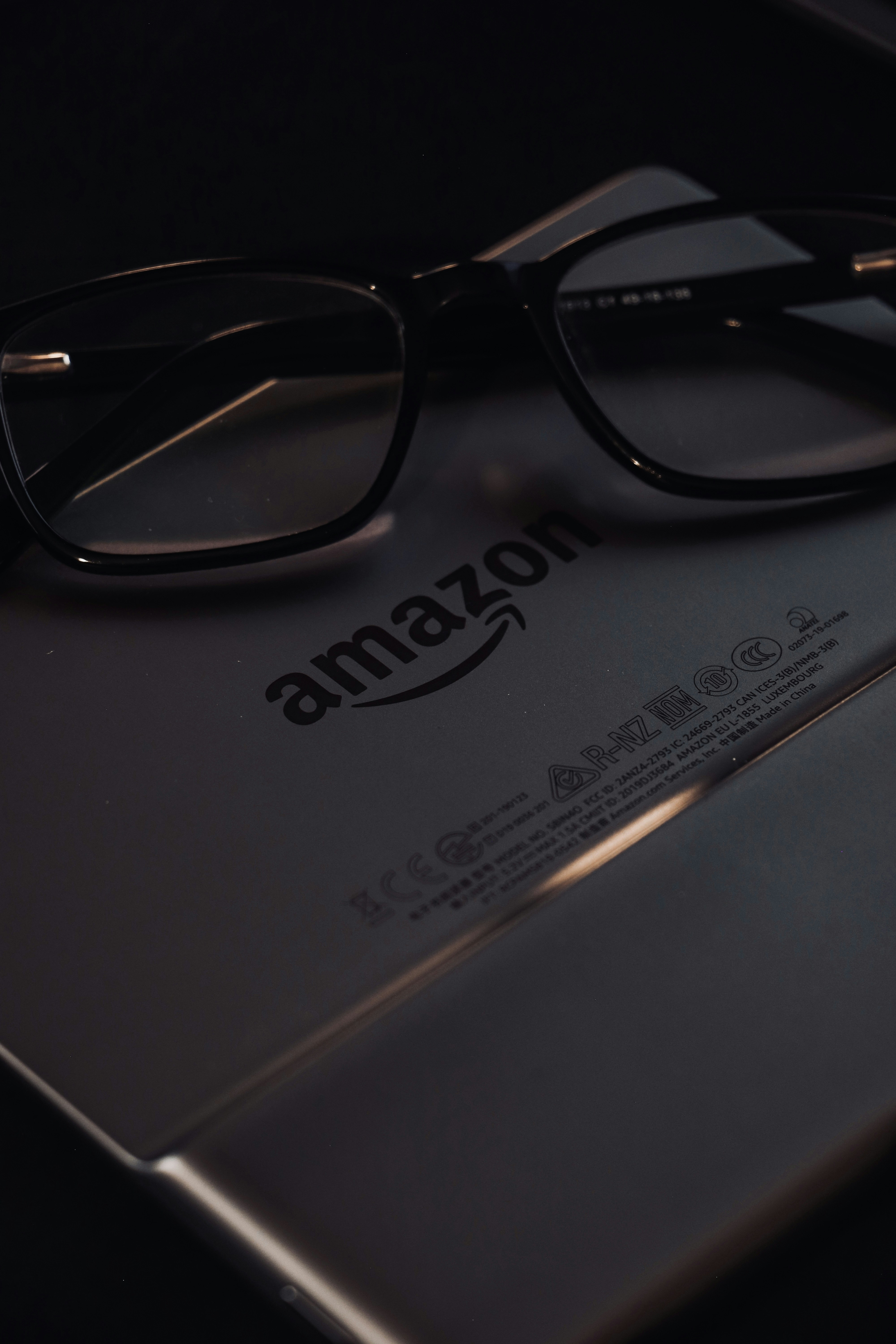 a pair of glasses sitting on top of a book