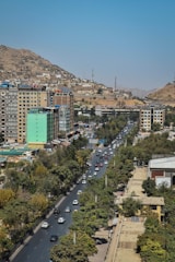 A bustling urban scene with vehicles on the move.