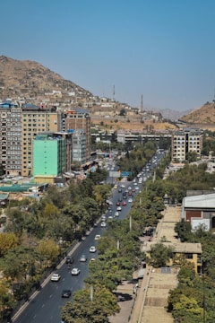 A bustling urban scene with vehicles on the move.