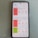 A smartphone displaying the IQAir app with air quality index information. The screen shows data for Kabupaten Bogor, Beijing, and Seoul, with varying air quality levels categorized as 'Unhealthy' for Bogor and Beijing, and 'Good' for Seoul. Weather conditions for the upcoming days are also listed.