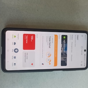 A smartphone displaying a vibrant, user-friendly app designed for Indonesian users.