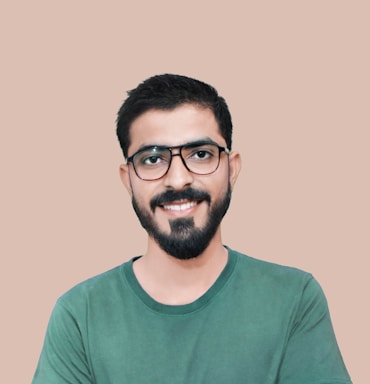 A friendly customer support representative wearing a headset, smiling against a clean, light green background.