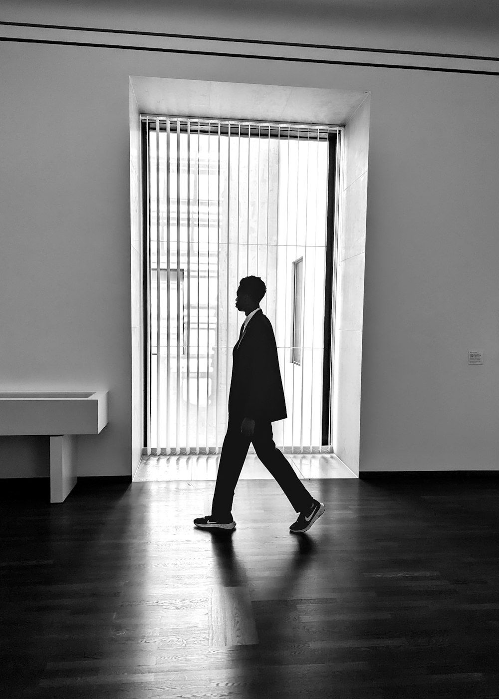 a black and white photo of a man in a suit