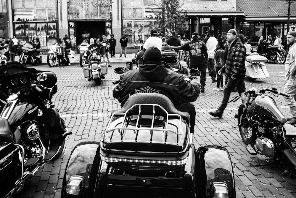 a black and white photo of a group of motorcycles