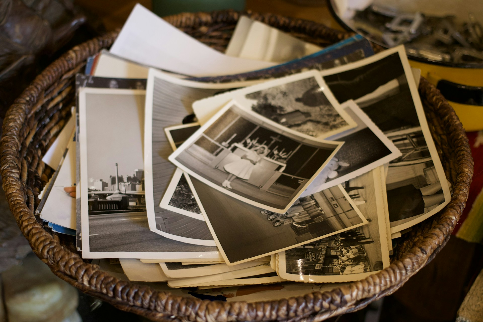 a basket filled with lots of pictures on top of a table