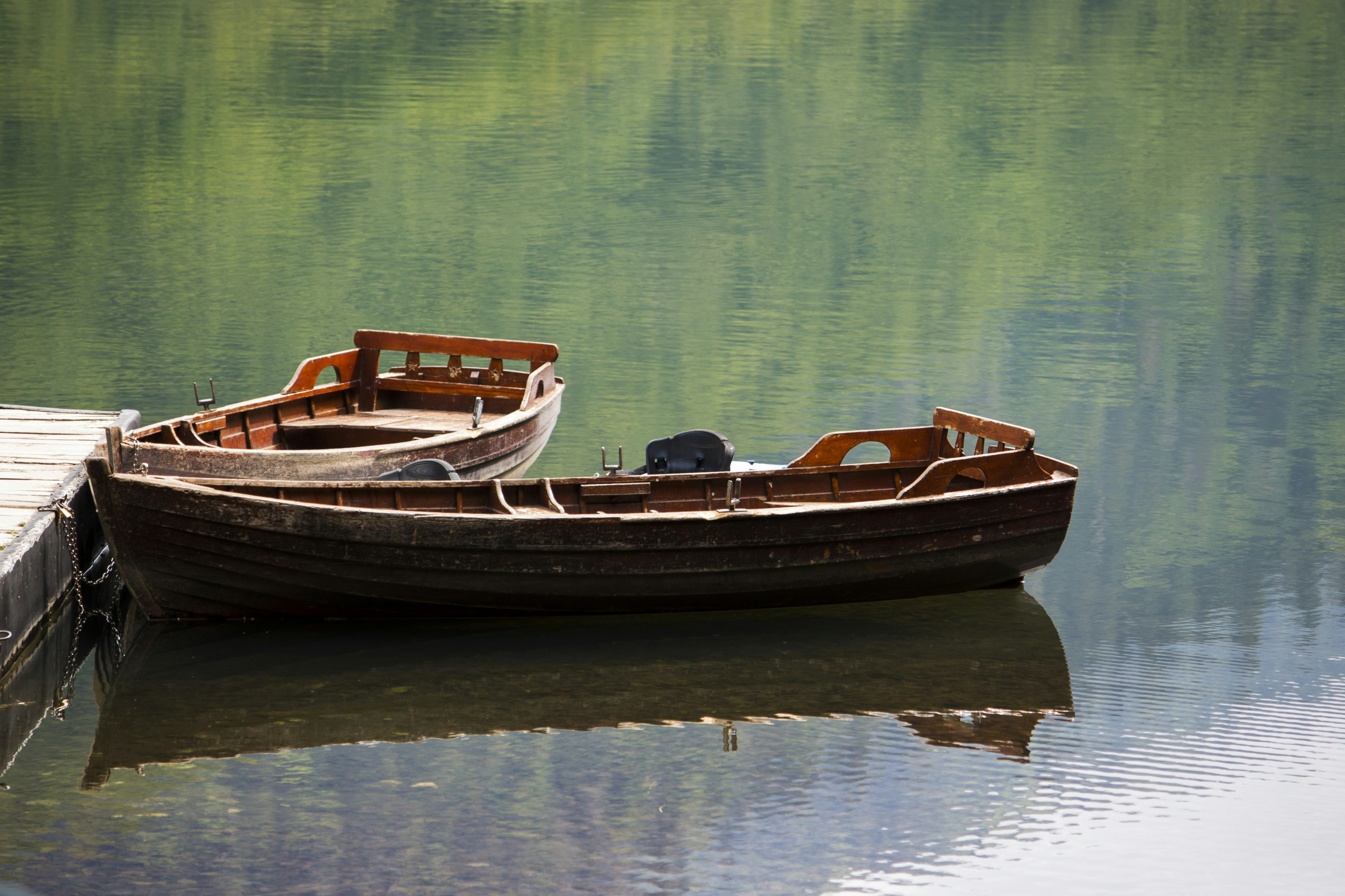 a small boat sitting on top of a body of water