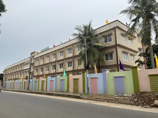 a row of multicolored buildings on the side of a road