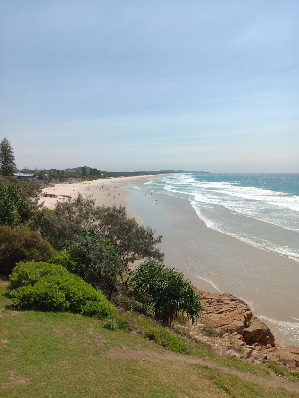 a view of a beach from a hill