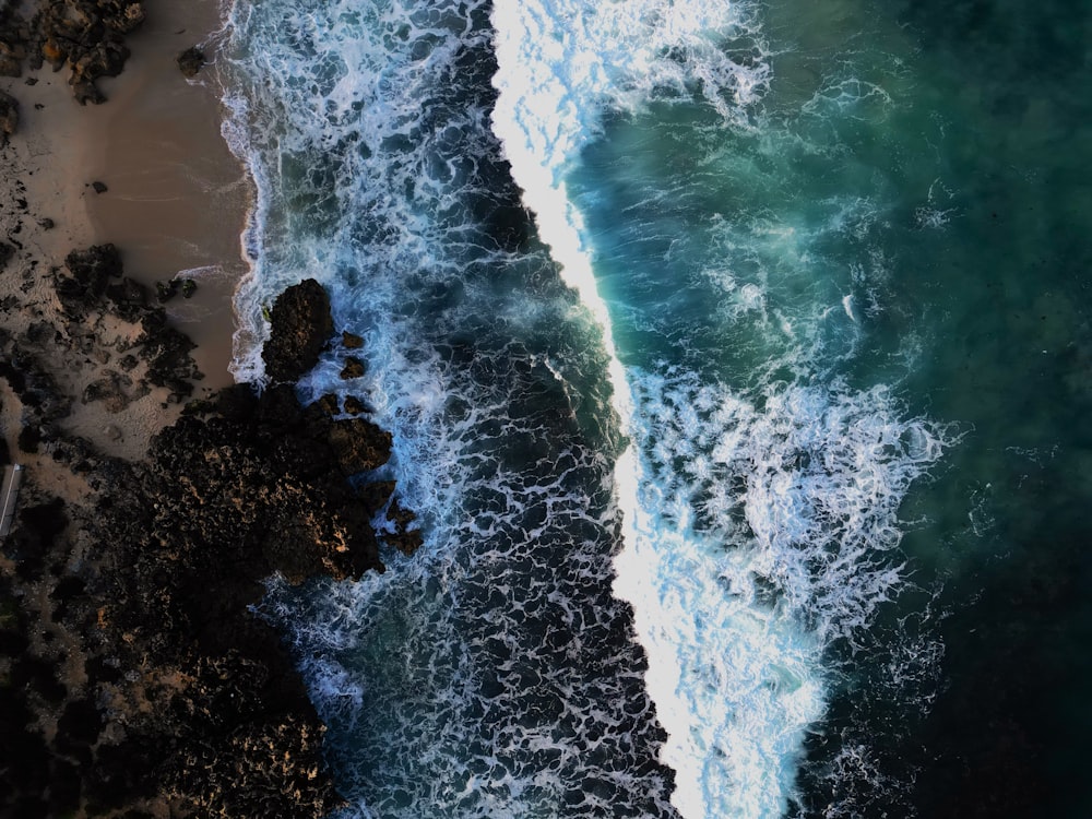 an aerial view of the ocean and the beach