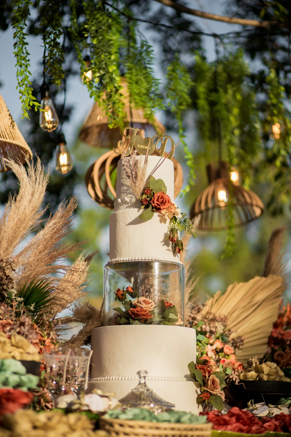 a three tiered wedding cake sitting on top of a table