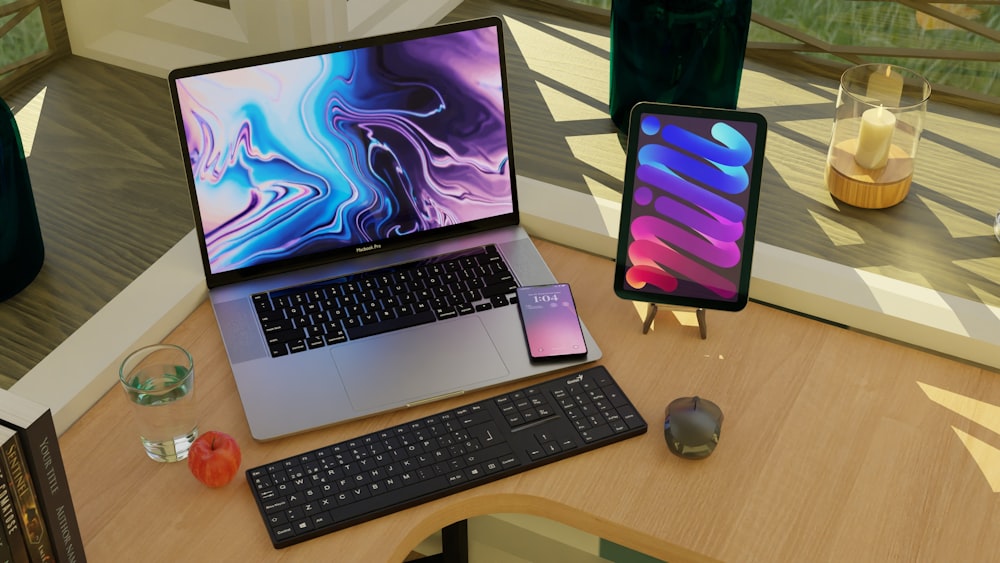 a laptop computer sitting on top of a wooden desk