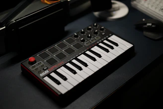 Side station with Novation 25-key MIDI controller and Akai MPCX workstation ready for beat making