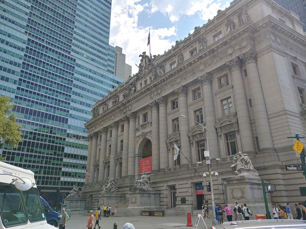 a bus is parked in front of a large building