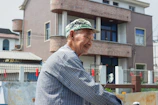 A smiling buyer holding a checklist, standing in front of a cozy home setting.