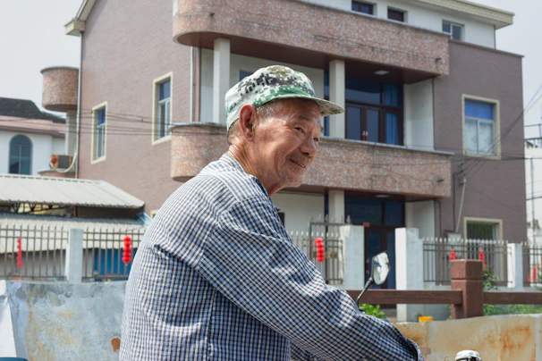 A smiling retiree enjoying their home, highlighting the lifetime housing offer.