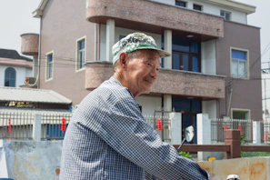 A smiling buyer holding a checklist, standing in front of a cozy home setting.