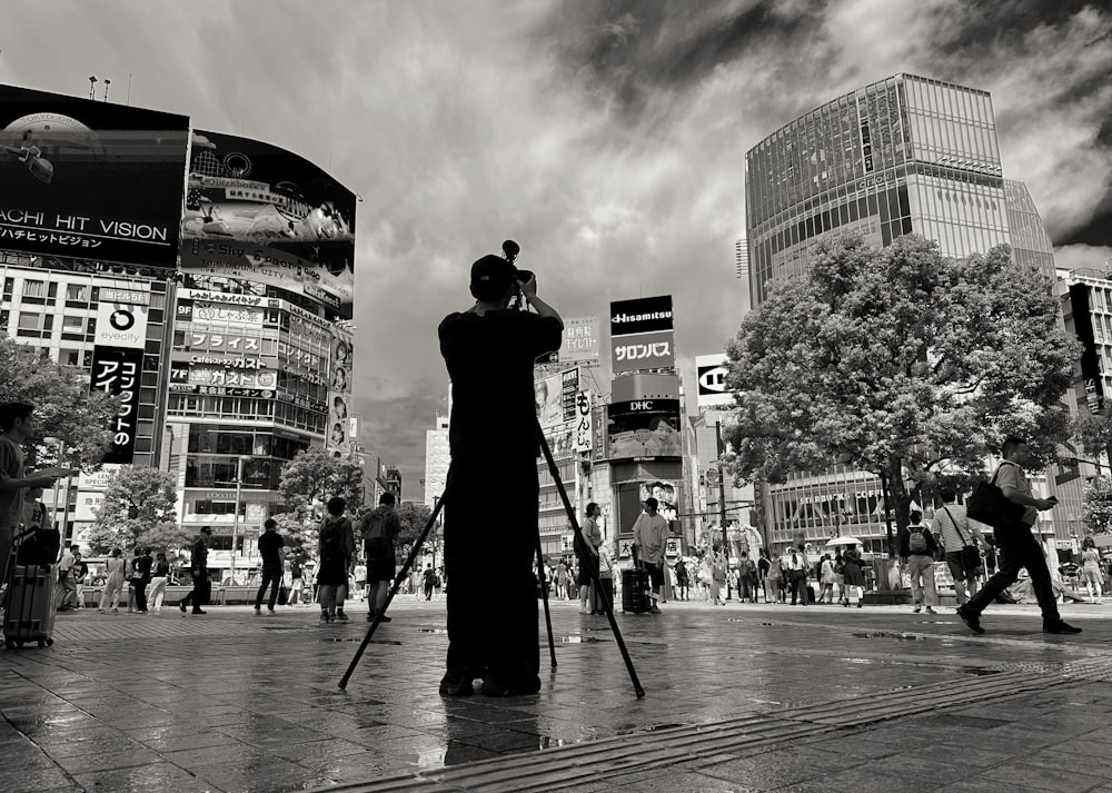 a black and white photo of a person taking a picture