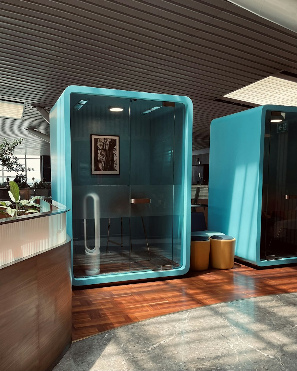 a bathroom with a blue wall and a wooden floor