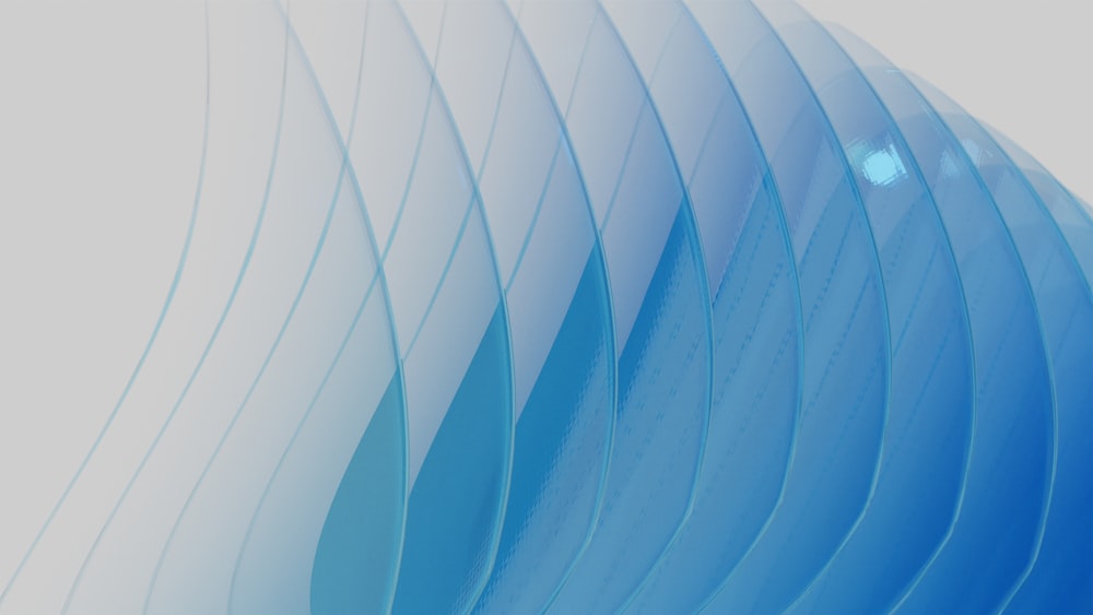 a blue and white abstract background with wavy lines