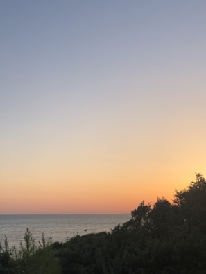 A serene sunset view over the ocean horizon.