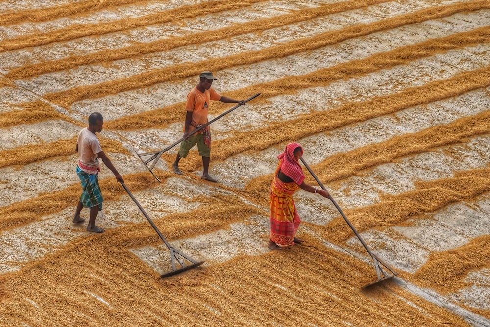 a group of people that are standing in the dirt