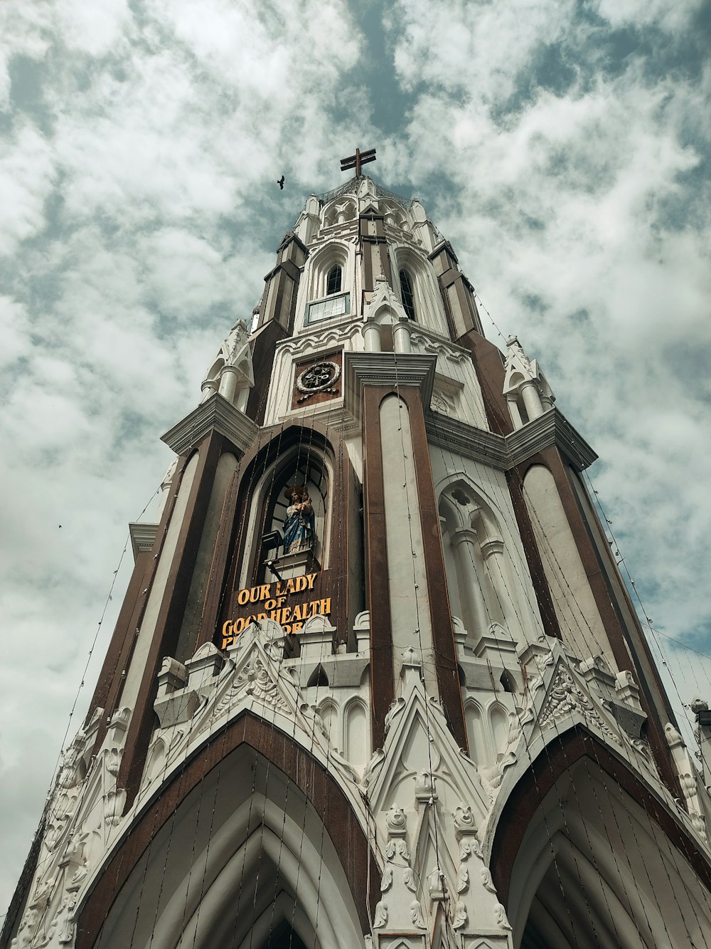 a very tall building with a clock on it's side