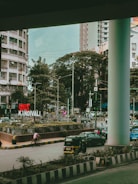A bustling street scene outside a residential building in Bandra.
