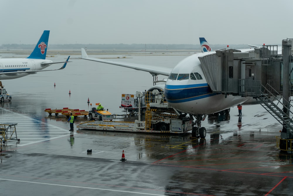 a large jetliner sitting on top of an airport tarmac