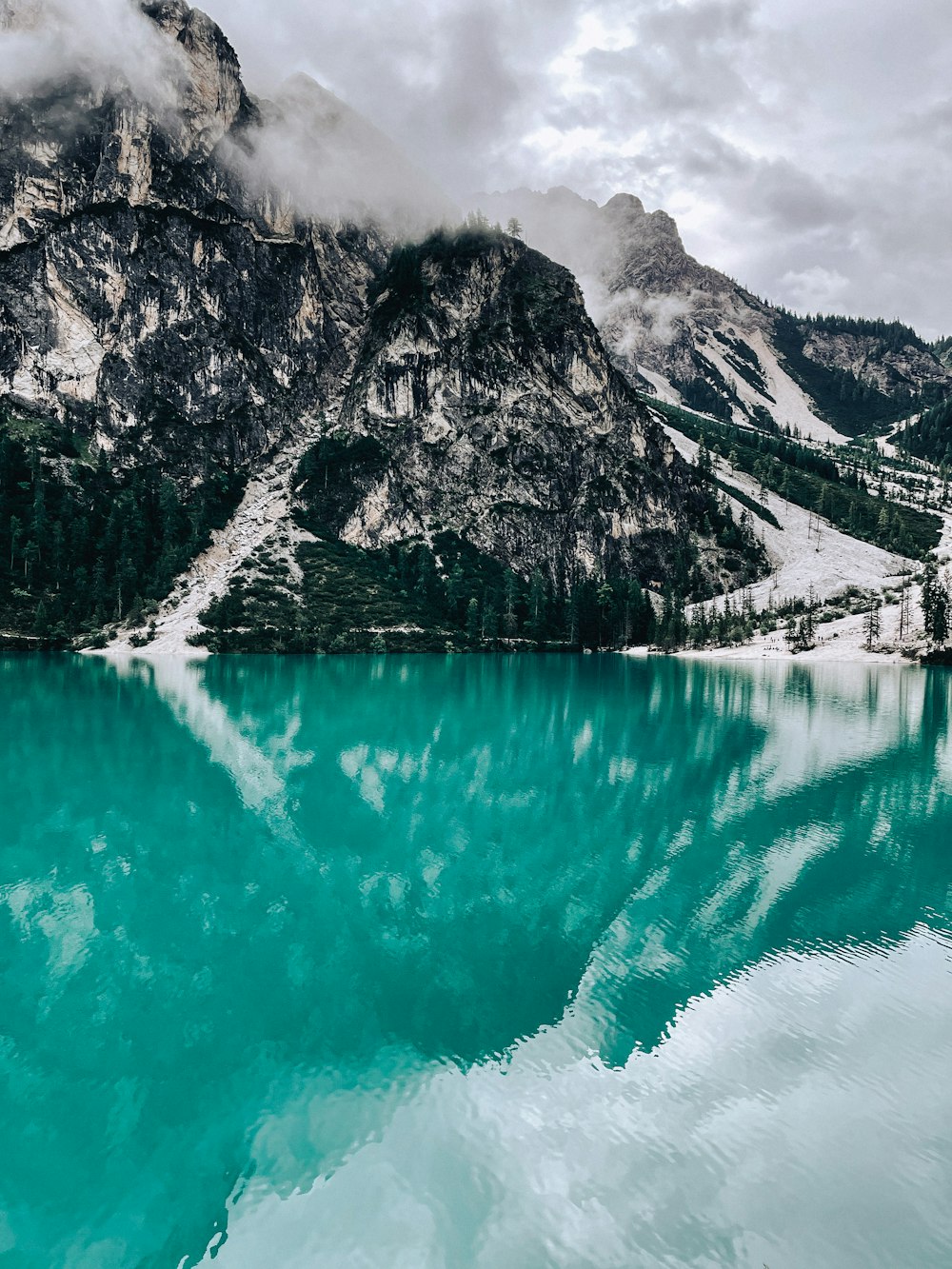 a lake with a mountain in the background