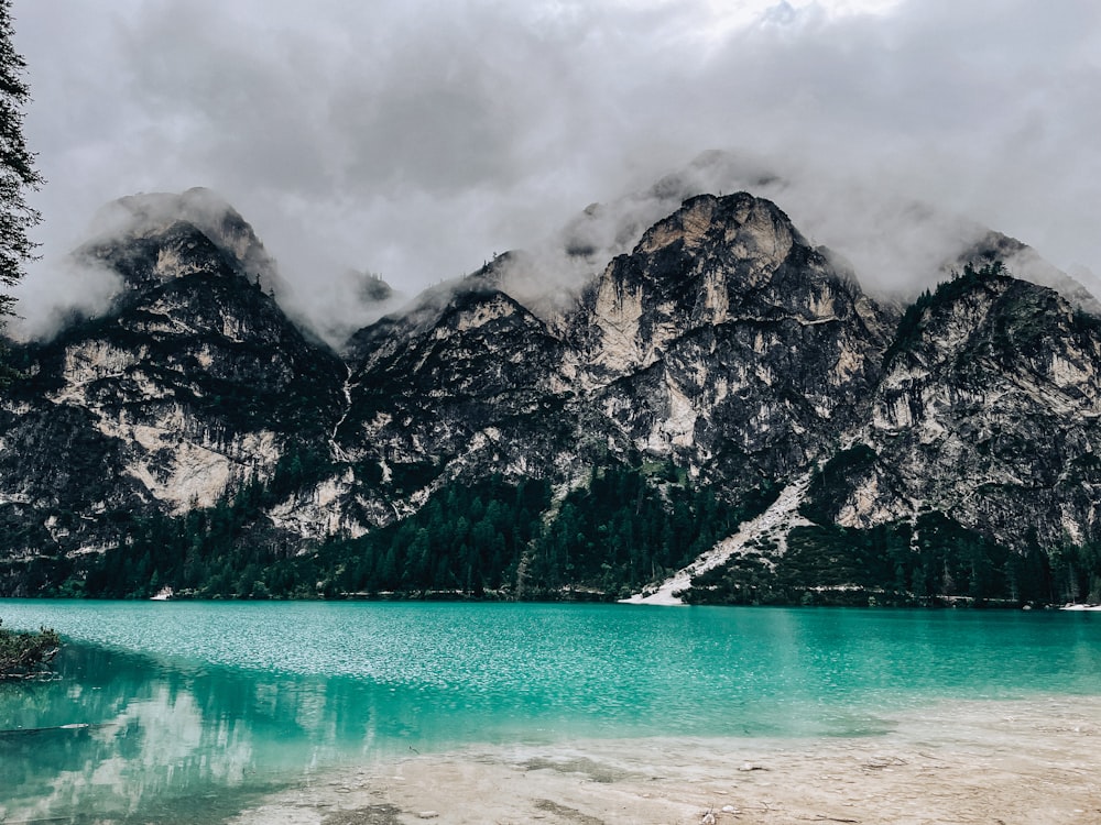 a mountain range with a body of water in front of it