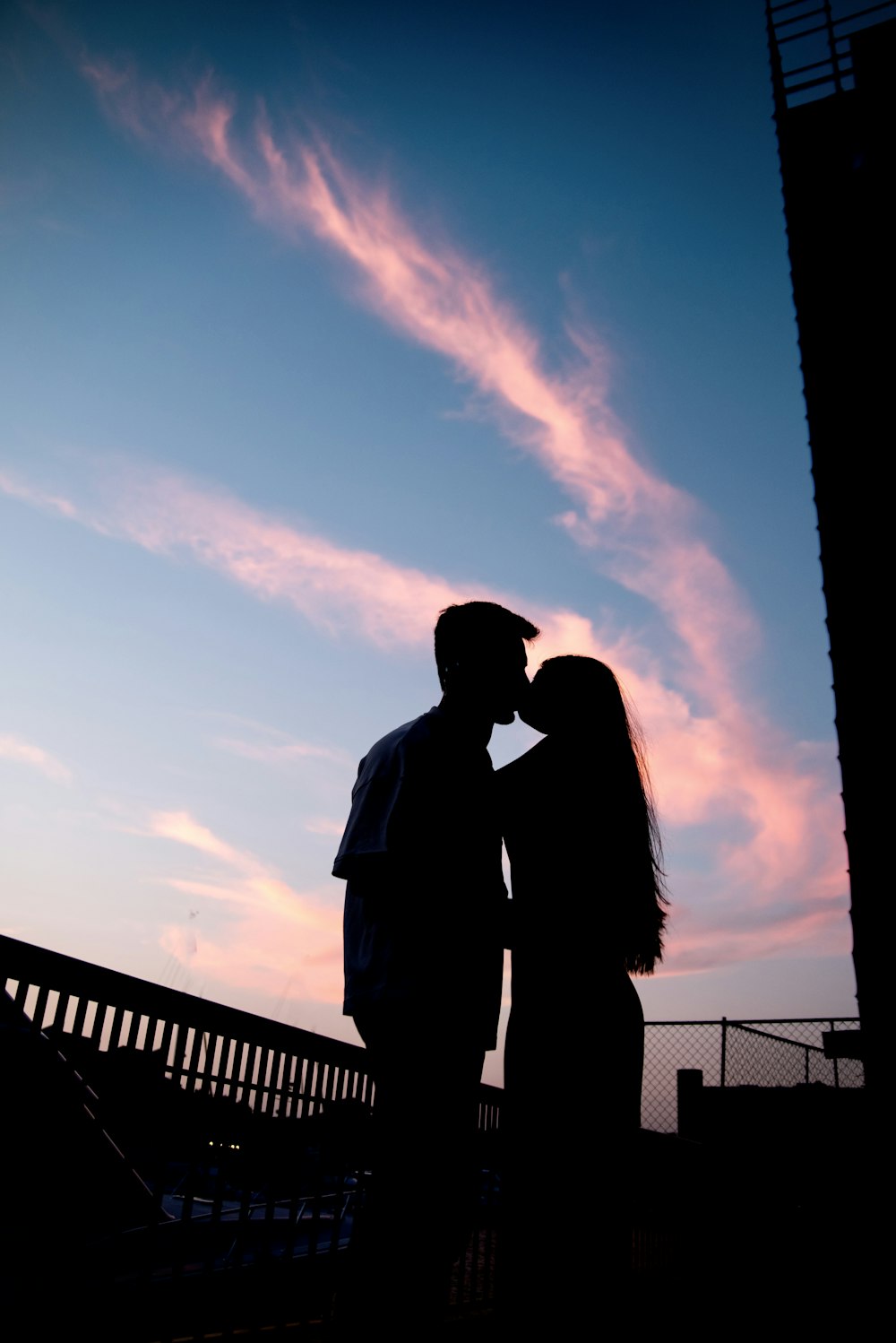 a man and a woman standing next to each other