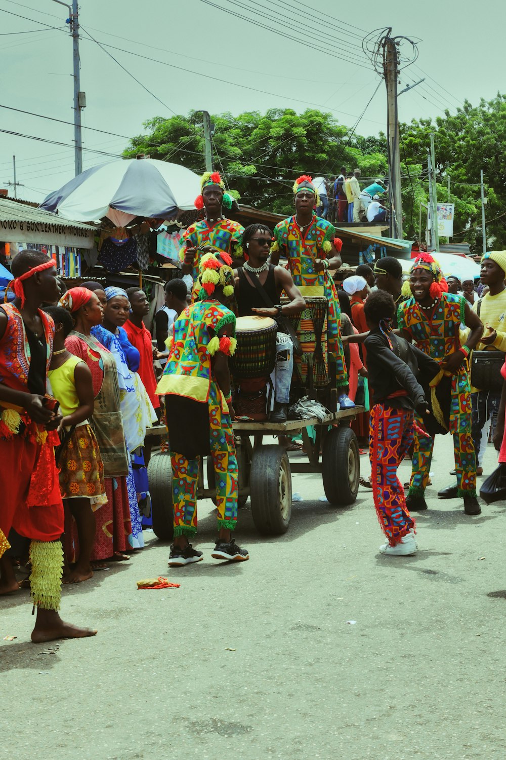 a group of people that are standing in the street