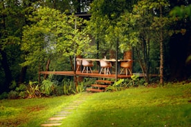 Serene garden patio with natural wood decking and greenery.