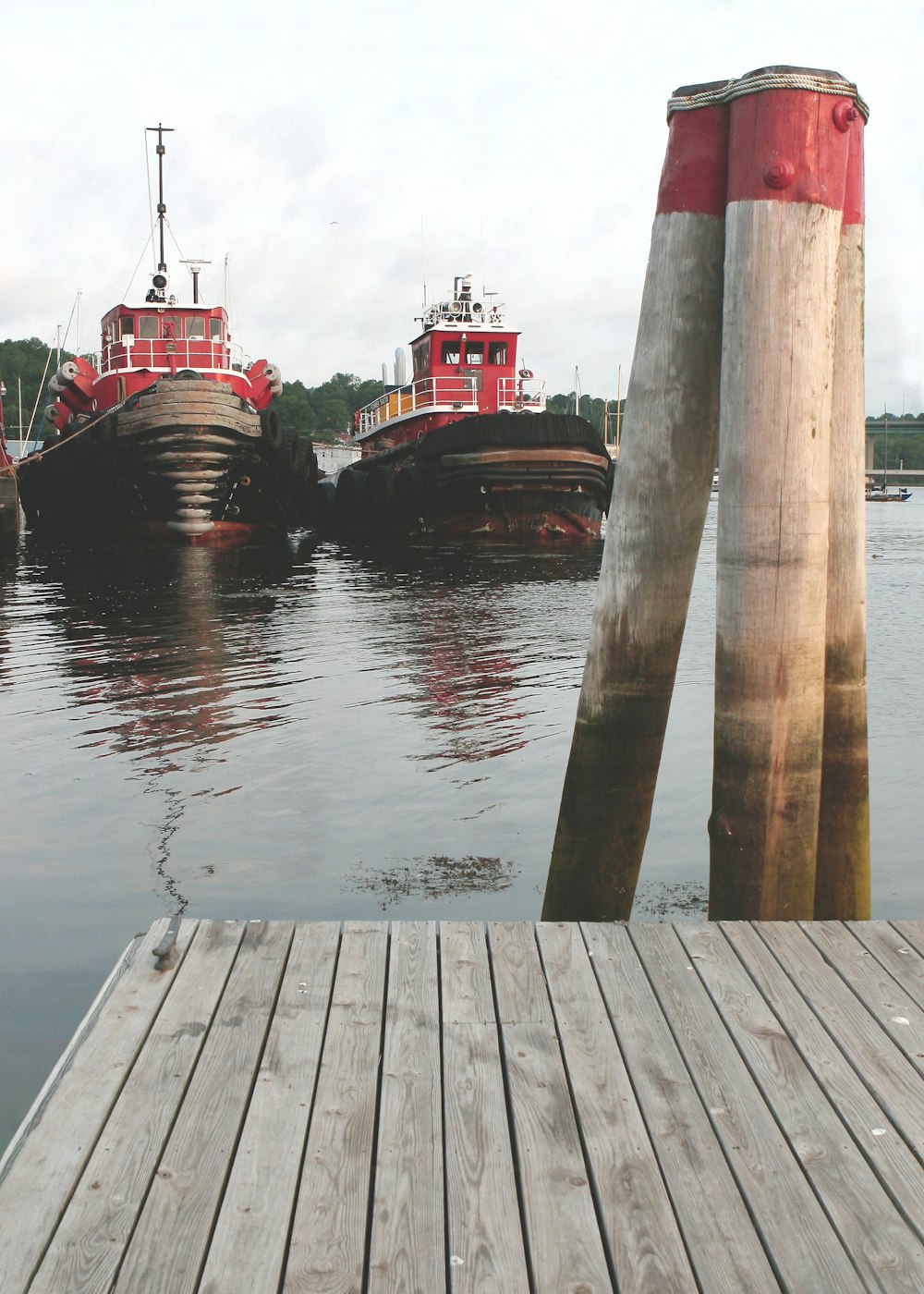 a dock with several boats in the water