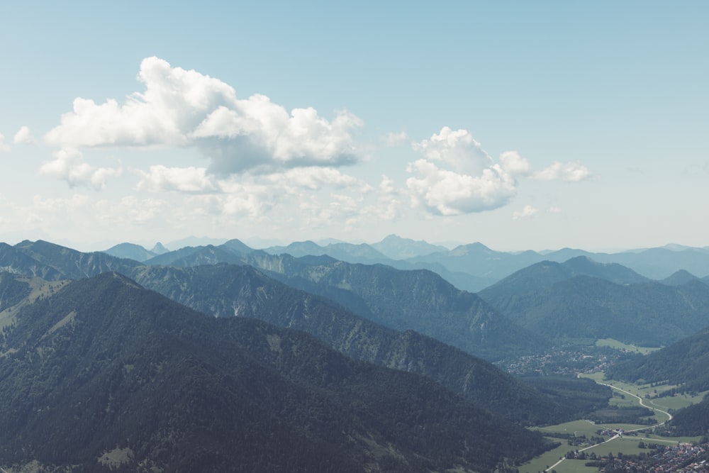 a view of a valley and mountains from a high point of view