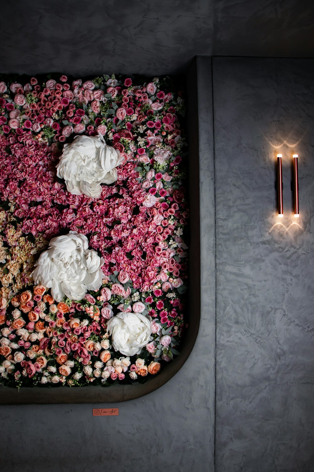 a table with flowers and candles on it