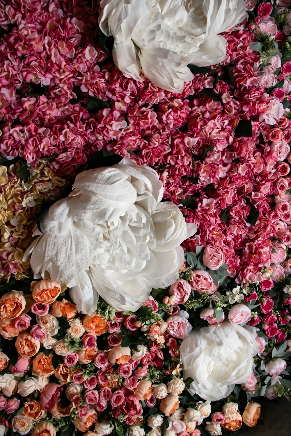 a bunch of flowers that are laying on a table