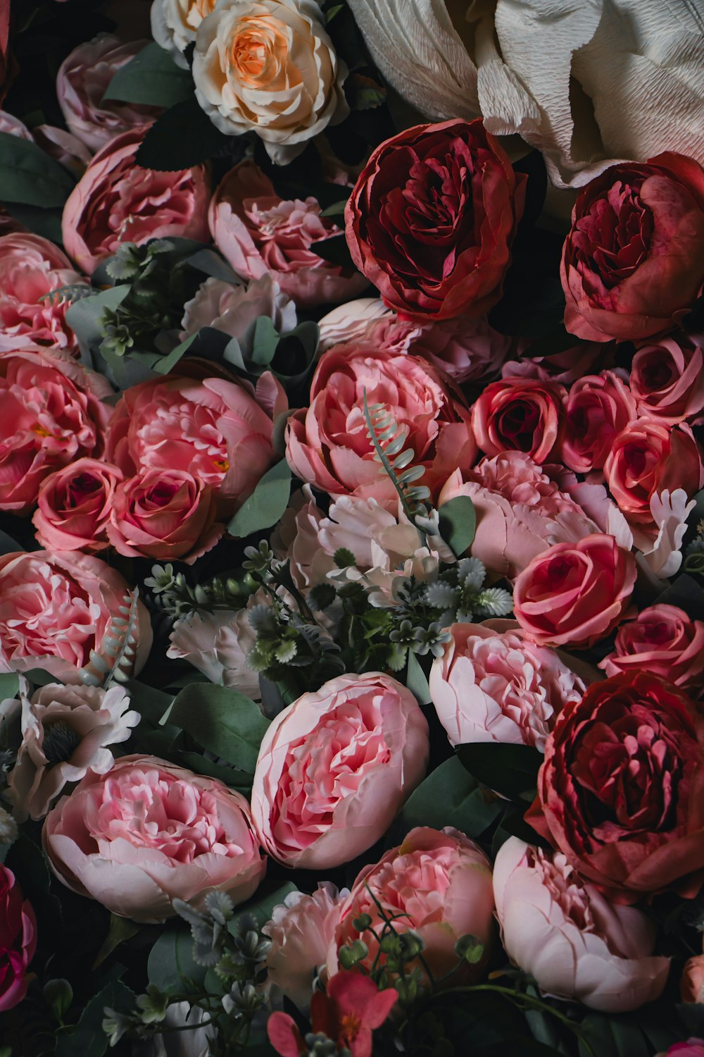 a bunch of flowers that are laying on a table